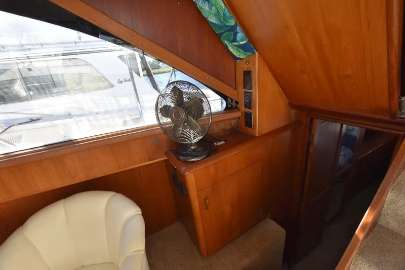 My Love Yacht Photos Pics Interior of 1993 Ocean Yachts 44 Aft Cabin with fan and wooden cabinetry.