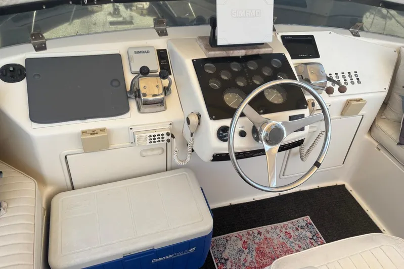 My Love Yacht Photos Pics 1993 Ocean Yachts 44 Aft Cabin helm with steering wheel and navigation equipment.