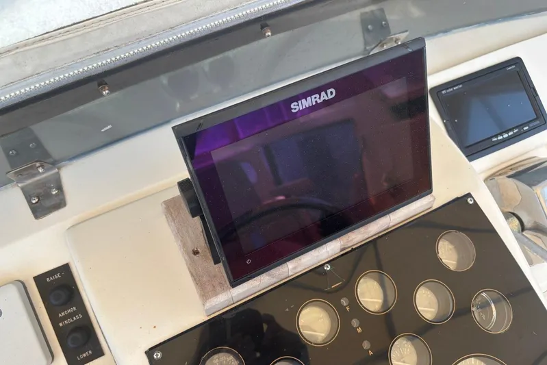 My Love Yacht Photos Pics Simrad navigation system on 1993 Ocean Yachts 44 Aft Cabin dashboard.