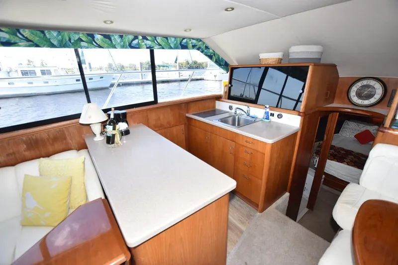 My Love Yacht Photos Pics Interior of 1993 Ocean Yachts 44 Aft Cabin with kitchen and seating area.