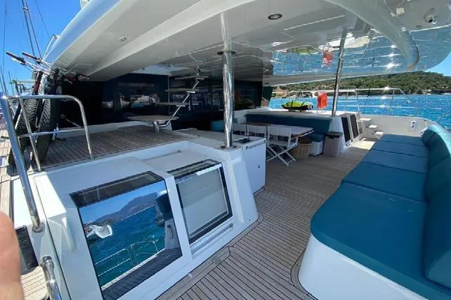  Yacht Photos Pics Luxurious 2019 Lagoon 630 Motor Yacht with spacious deck and seating area.