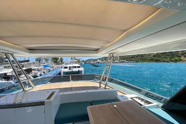  Yacht Photos Pics 2019 Lagoon 630 Motor Yacht with scenic marina view and turquoise waters.