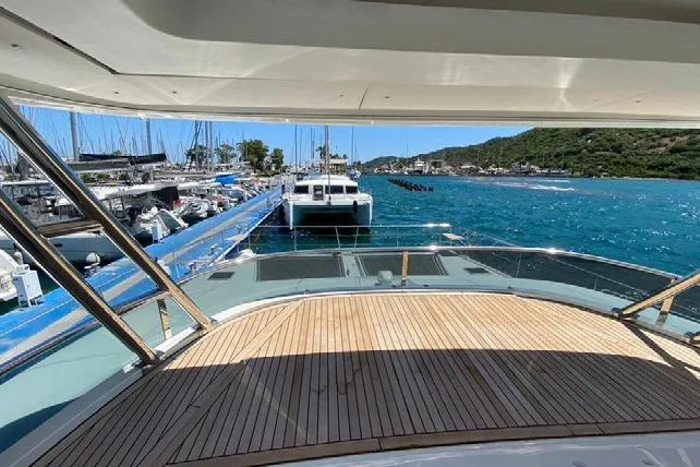  Yacht Photos Pics Lagoon 630 Motor Yacht 2019 docked at marina with scenic ocean view.