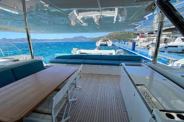  Yacht Photos Pics Luxurious 2019 Lagoon 630 Motor Yacht with spacious deck and stunning ocean view.