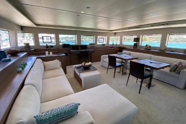  Yacht Photos Pics Luxurious interior of 2019 Lagoon 630 Motor Yacht with elegant seating and panoramic windows.