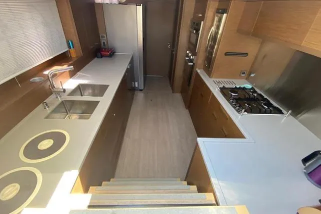  Yacht Photos Pics Modern kitchen interior of 2019 Lagoon 630 Motor Yacht with sleek countertops and appliances.