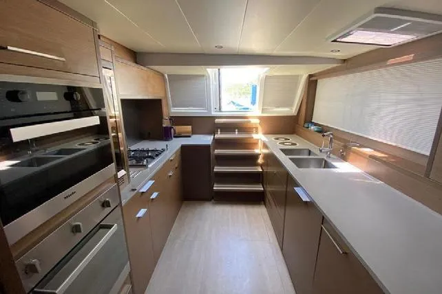  Yacht Photos Pics Modern kitchen interior of 2019 Lagoon 630 Motor Yacht with sleek appliances and ample counter space.