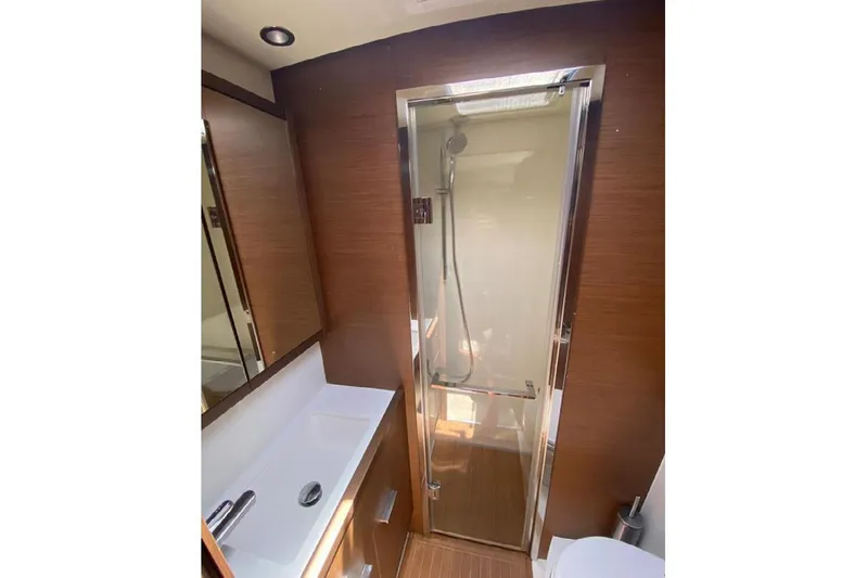  Yacht Photos Pics Luxurious bathroom in 2019 Lagoon 630 Motor Yacht with modern shower and sleek design.