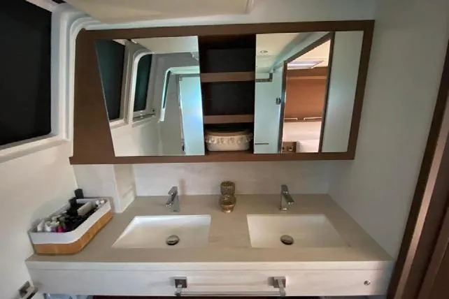 Yacht Photos Pics Luxury bathroom with dual sinks on 2019 Lagoon 630 Motor Yacht.