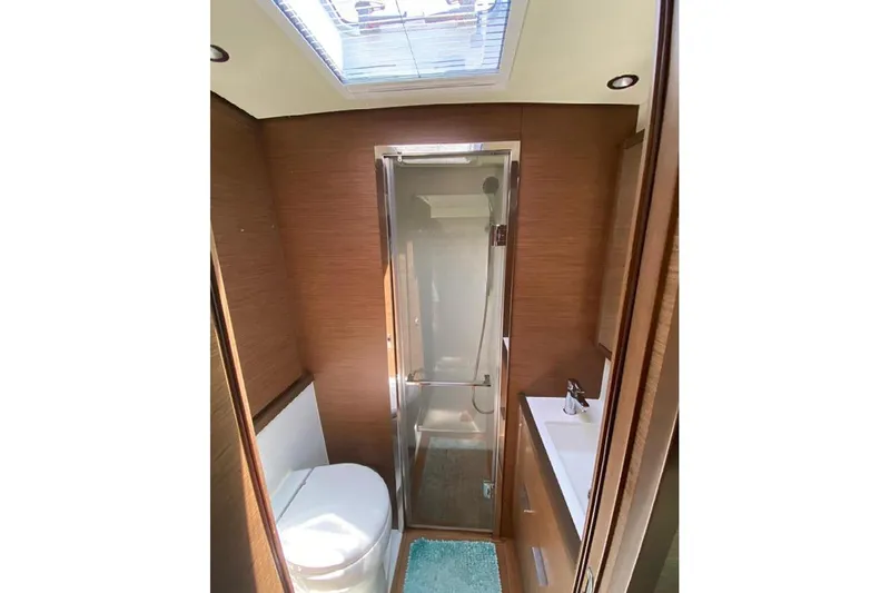  Yacht Photos Pics Luxurious bathroom in 2019 Lagoon 630 Motor Yacht with shower and skylight.