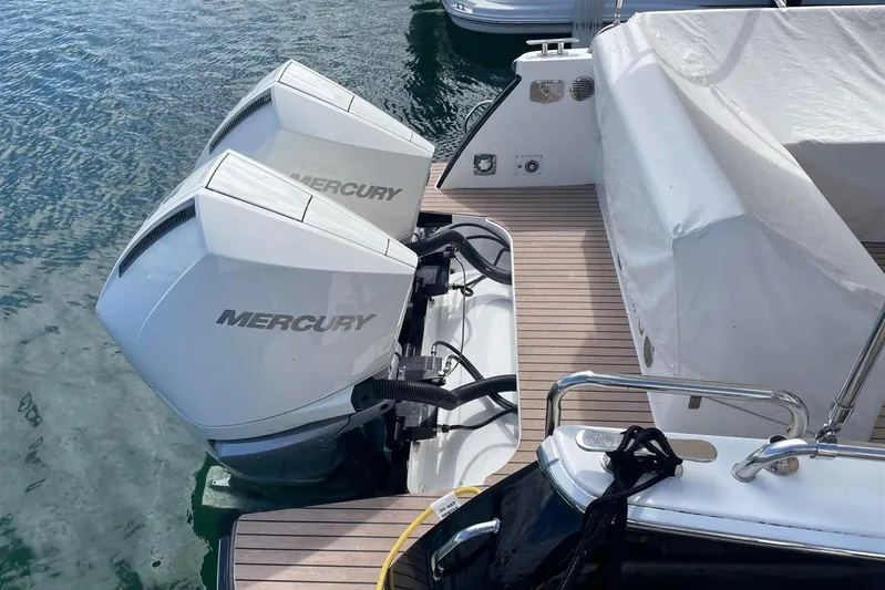 O-m-g Yacht Photos Pics 2023 MJM 3 boat with dual Mercury outboard engines on calm water.