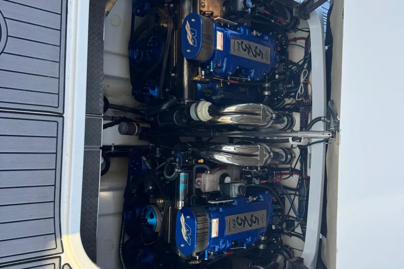  Yacht Photos Pics Engine compartment of a 2006 Formula 400 Super Sport boat, featuring dual blue engines.