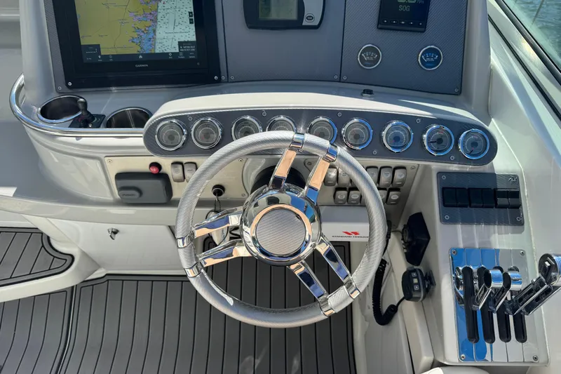  Yacht Photos Pics Steering console of a 2006 Formula 400 Super Sport boat with navigation instruments.