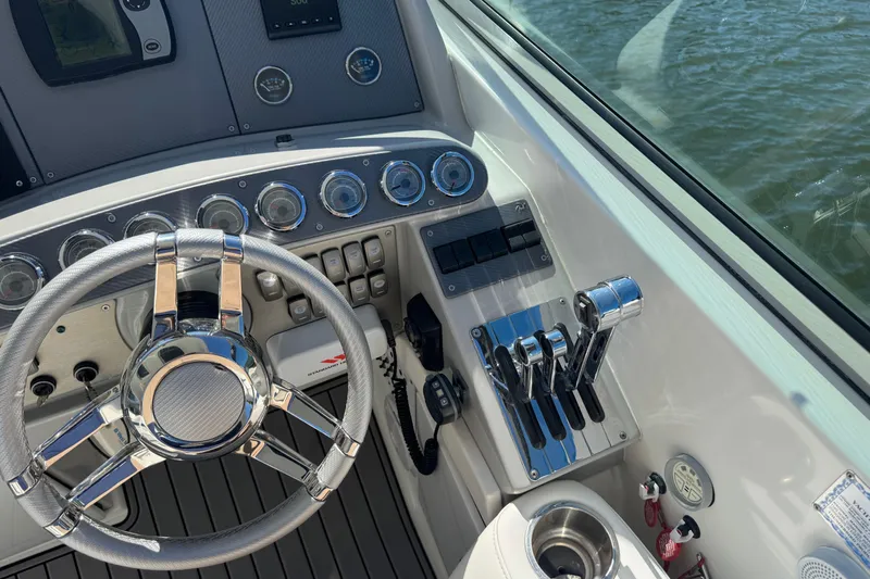  Yacht Photos Pics 2006 Formula 400 Super Sport boat dashboard with steering wheel and controls.