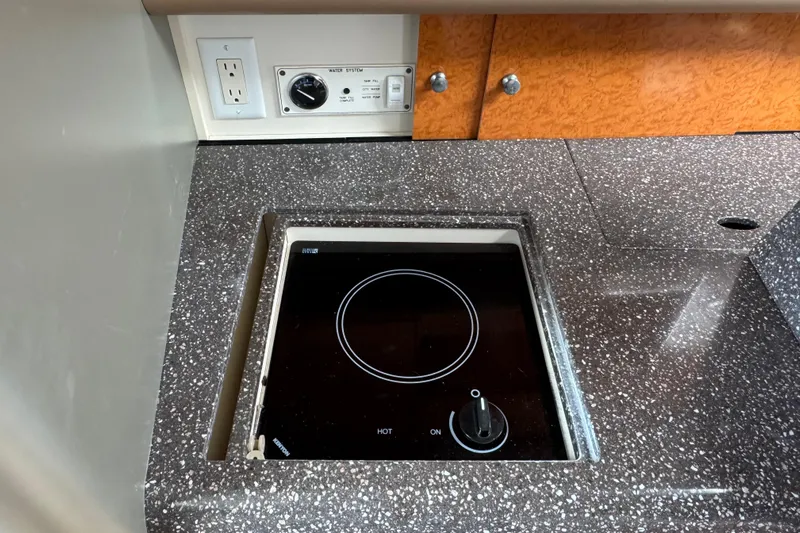  Yacht Photos Pics 2006 Formula 400 Super Sport yacht kitchen with electric stove and control panel.