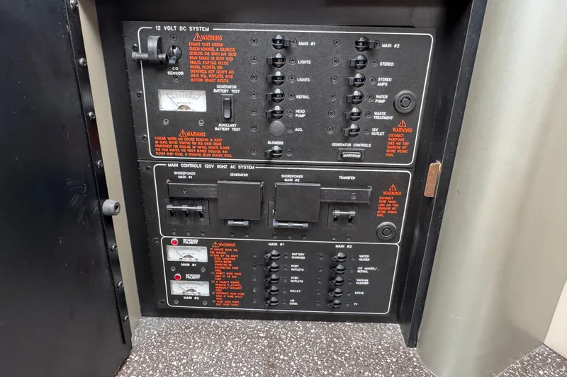  Yacht Photos Pics Electrical control panel of a 2006 Formula 400 Super Sport boat, featuring various switches and warnings.