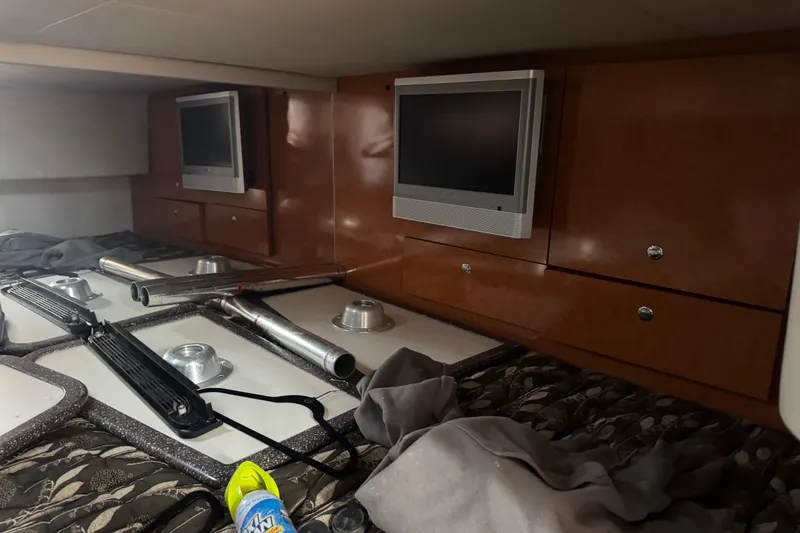  Yacht Photos Pics Interior of 2006 Formula 400 Super Sport with TV, wooden cabinets, and various equipment.