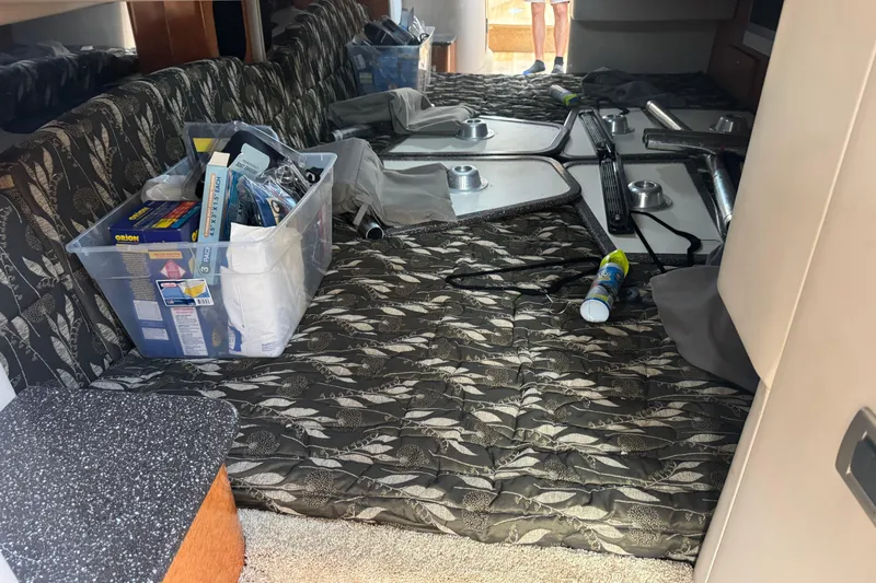  Yacht Photos Pics Interior of a 2006 Formula 400 Super Sport boat with storage items and patterned upholstery.