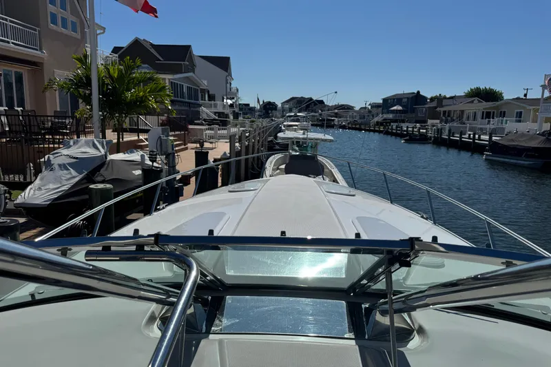 Yacht Photos Pics 2006 Formula 400 Super Sport yacht docked in a scenic residential canal.