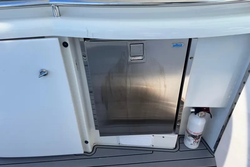  Yacht Photos Pics 2006 Formula 400 Super Sport boat galley with stainless steel fridge and fire extinguisher.