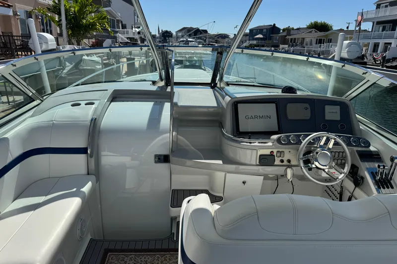  Yacht Photos Pics 2006 Formula 400 Super Sport boat cockpit with Garmin navigation system, docked in a marina.