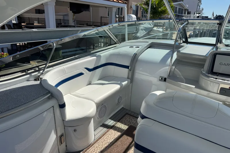  Yacht Photos Pics Interior of a 2006 Formula 400 Super Sport boat with white seating and sleek design.