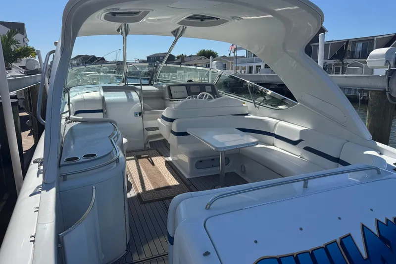  Yacht Photos Pics 2006 Formula 400 Super Sport boat interior with seating and helm, docked at marina.
