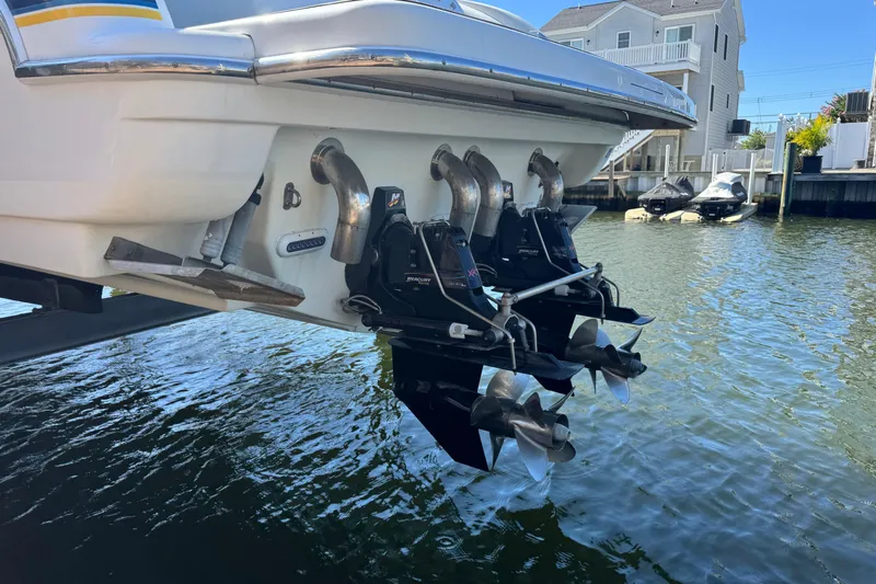  Yacht Photos Pics 2006 Formula 400 Super Sport boat with dual outboard motors in a marina setting.