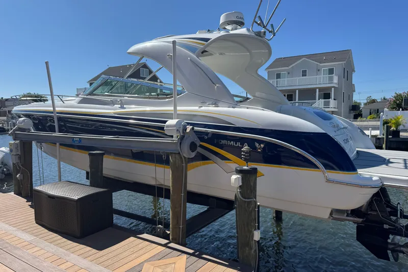  Yacht Photos Pics 2006 Formula 400 Super Sport boat docked, featuring sleek design and modern amenities.