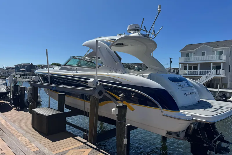  Yacht Photos Pics 2006 Formula 400 Super Sport boat docked at a marina under clear blue skies.