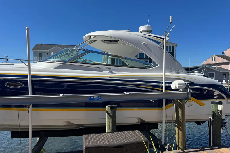  Yacht Photos Pics 2006 Formula 400 Super Sport boat docked under clear blue sky.