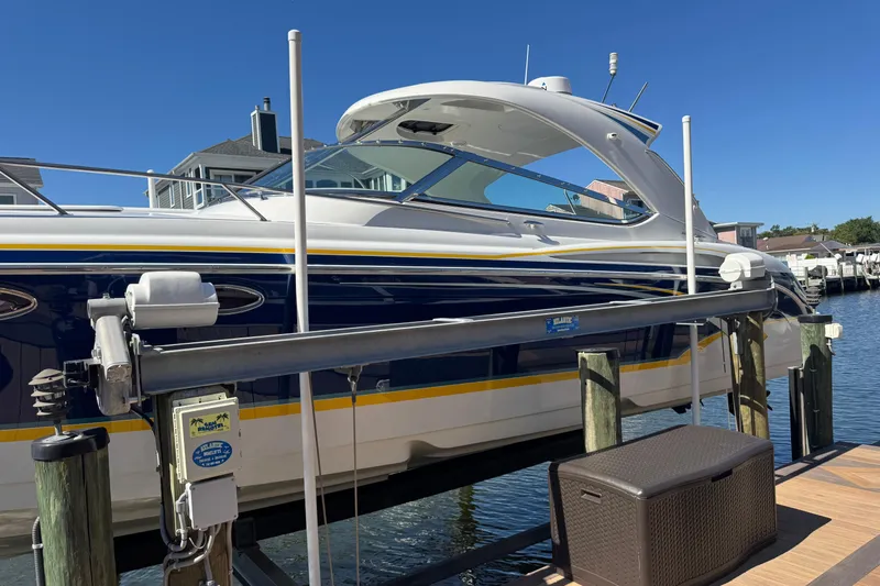  Yacht Photos Pics 2006 Formula 400 Super Sport boat docked at marina under clear blue sky.