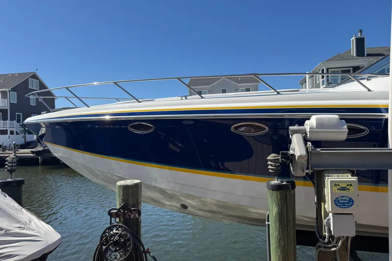  Yacht Photos Pics 2006 Formula 400 Super Sport boat docked at marina, blue and white exterior.