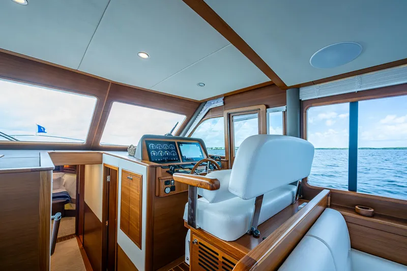Painkiller Yacht Photos Pics Interior of 2023 Grand Banks GB60 yacht, featuring helm station and ocean view.