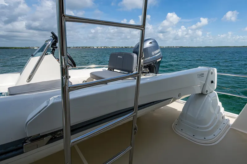 Painkiller Yacht Photos Pics 2023 Grand Banks GB60 yacht with Yamaha engine and ladder, overlooking the ocean.