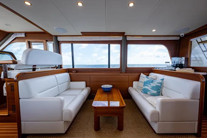 Painkiller Yacht Photos Pics Luxurious interior of 2023 Grand Banks GB60 yacht with ocean view.