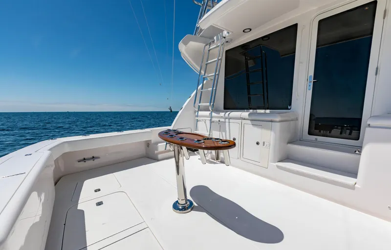  Yacht Photos Pics 2007 Bertram 570 yacht deck with ocean view, featuring ladder and table.
