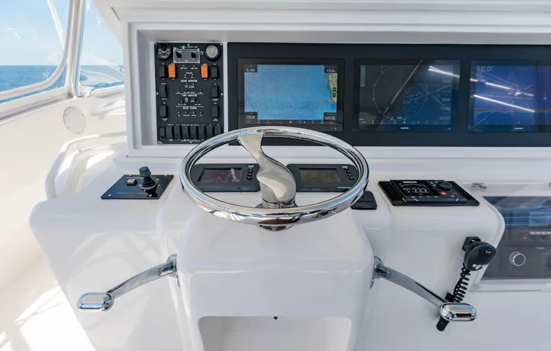  Yacht Photos Pics 2007 Bertram 570 yacht helm with modern navigation displays and controls.