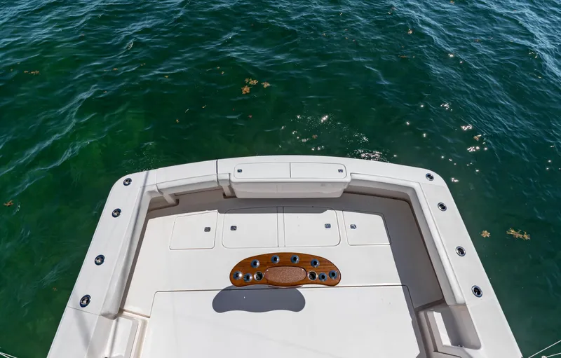  Yacht Photos Pics 2007 Bertram 570 boat deck overlooking clear blue water.