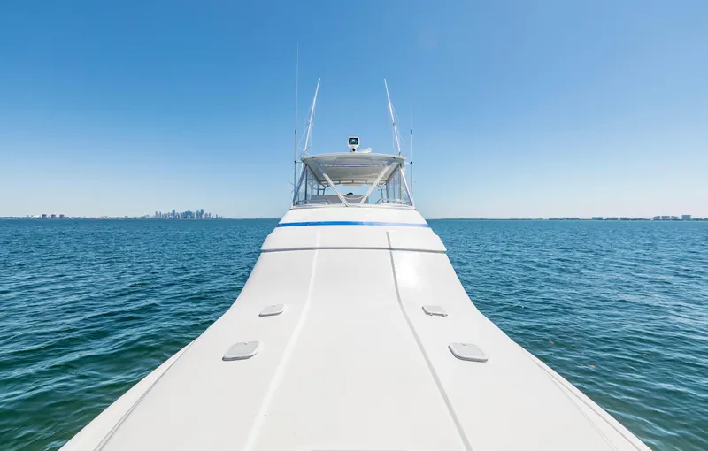  Yacht Photos Pics 2007 Bertram 570 yacht cruising on open sea under clear blue sky.