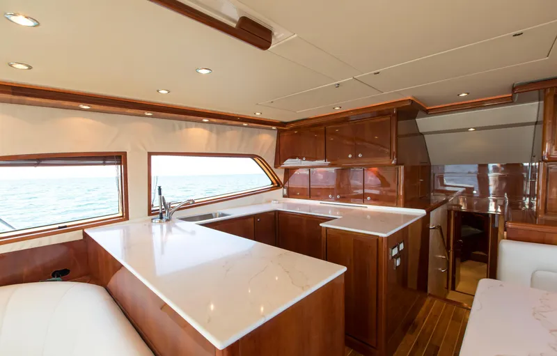  Yacht Photos Pics Luxurious interior of a 2007 Bertram 570 yacht with elegant wood finishes and modern design.