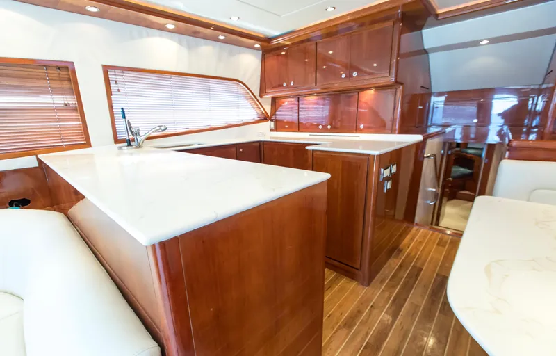  Yacht Photos Pics Luxurious 2007 Bertram 570 yacht interior with elegant wood cabinetry and modern kitchen design.