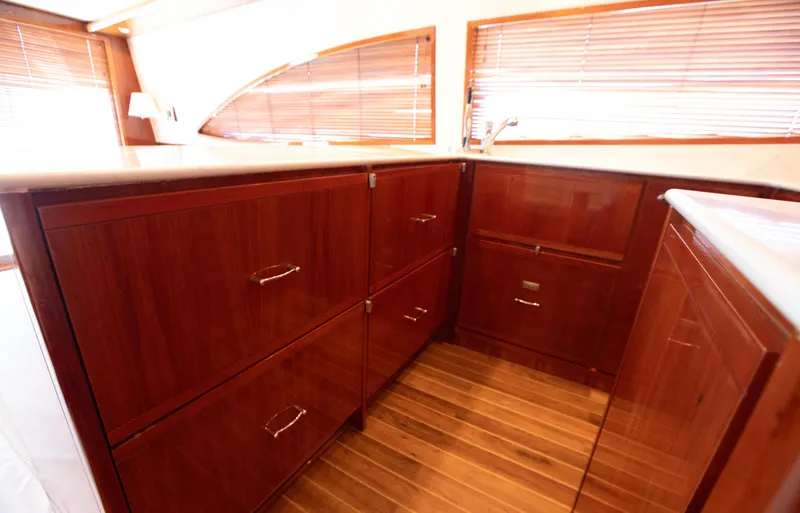  Yacht Photos Pics Luxurious wooden cabinetry in a 2007 Bertram 570 yacht interior.