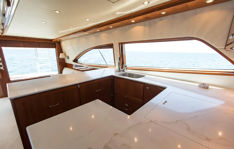  Yacht Photos Pics Luxurious interior of a 2007 Bertram 570 yacht with elegant countertops and ocean view.
