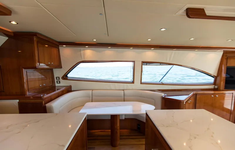  Yacht Photos Pics Luxurious interior of a 2007 Bertram 570 yacht with elegant wood and marble finishes.
