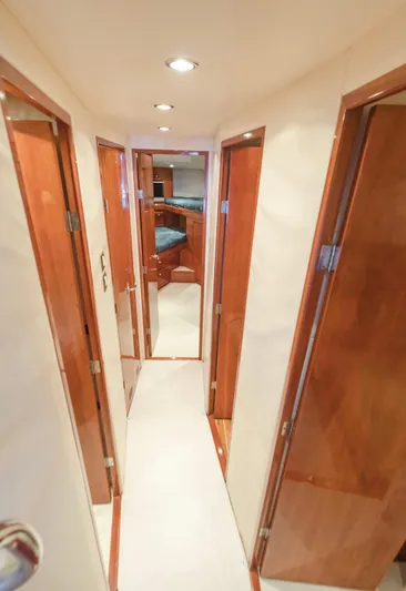  Yacht Photos Pics Hallway inside 2007 Bertram 570 yacht with wooden doors and recessed lighting.