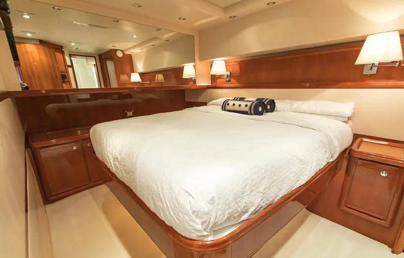  Yacht Photos Pics Luxurious cabin interior of 2007 Bertram 570 yacht with elegant wood finish.