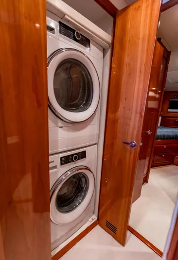  Yacht Photos Pics Stacked washer and dryer in 2007 Bertram 570 yacht's wooden interior.