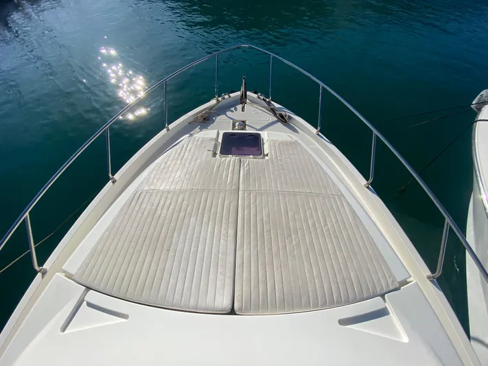  Yacht Photos Pics Bow view of 2012 Ferretti Yachts 500, featuring sun deck and calm water reflections.