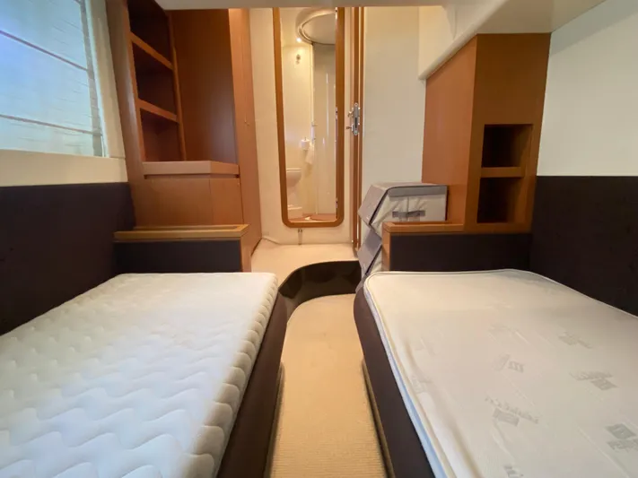  Yacht Photos Pics Twin cabin interior of 2012 Ferretti Yachts 500 with modern design and cozy beds.